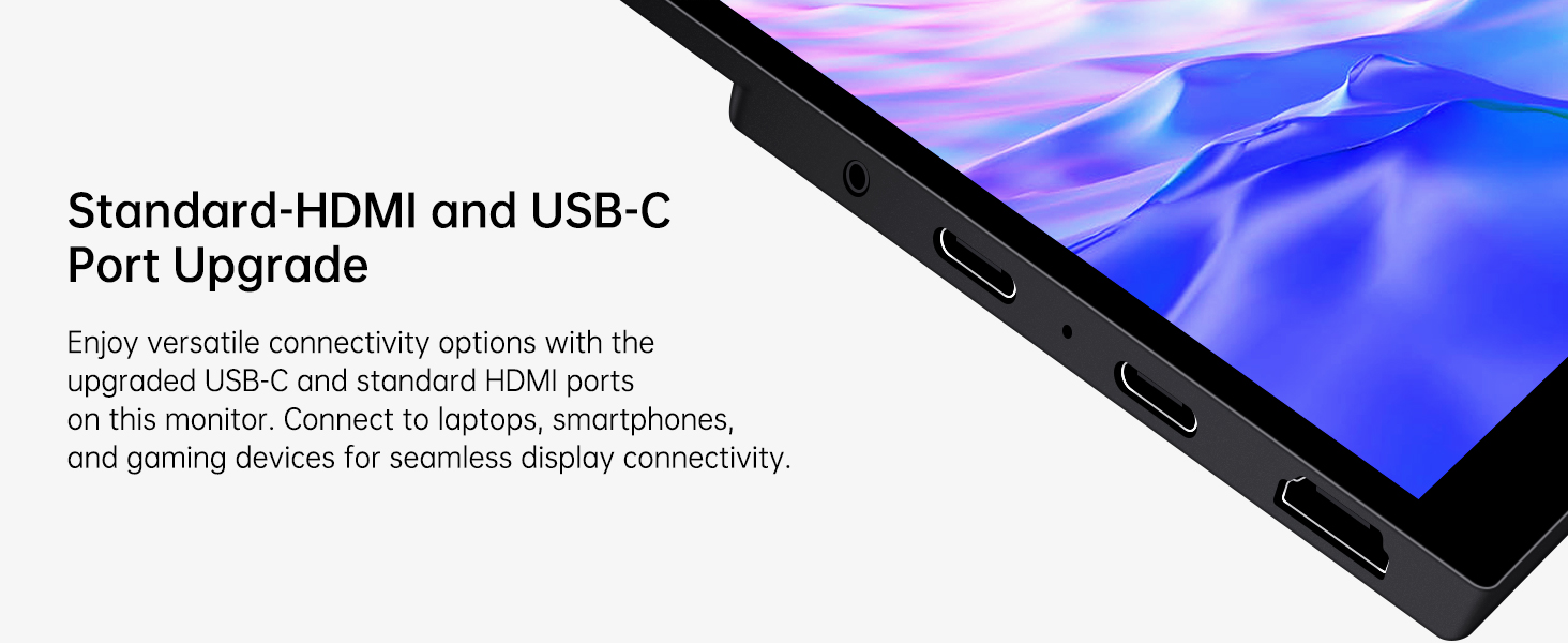 Monitor portatil tactil de 15.6 pulgadas con vidrio templado y soporte integrado junto a un notebook en un escritorio.